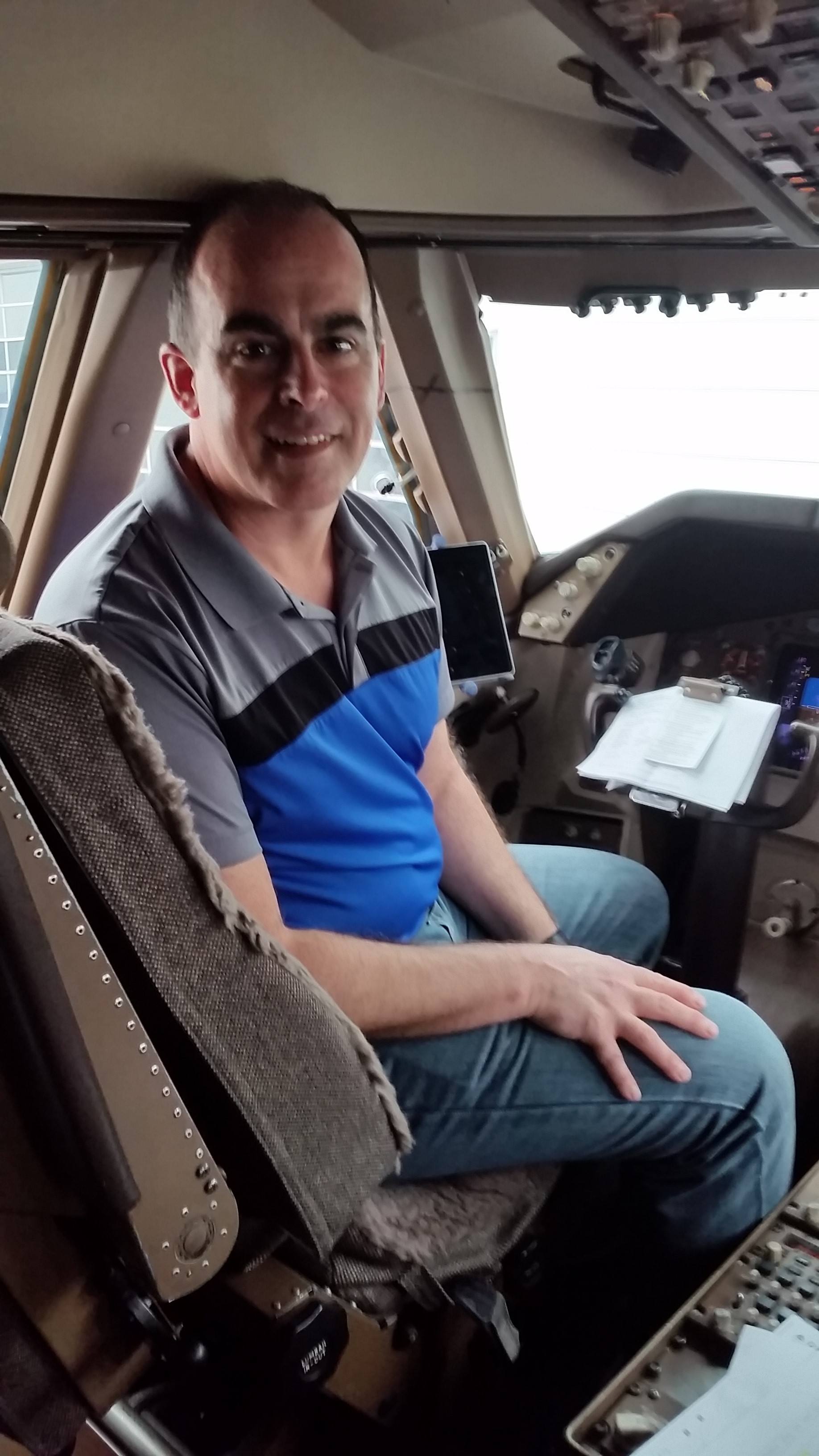 John Lomas at the controls of a Delta Boeing 747 aircraft.